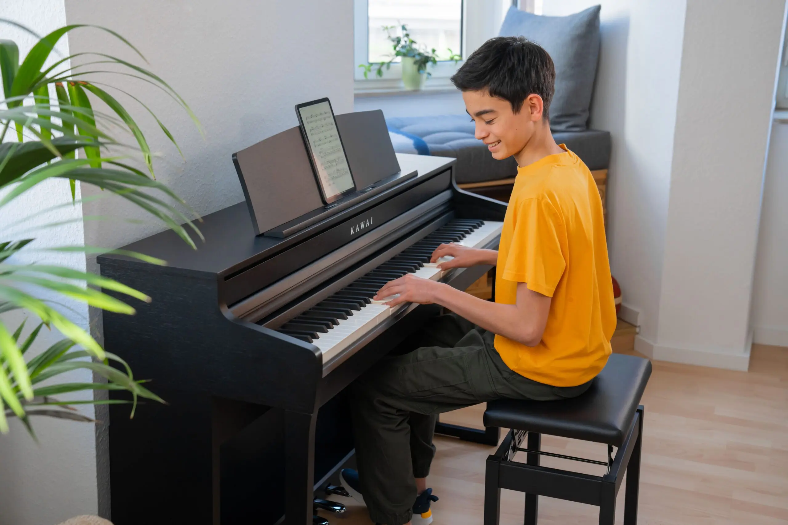 Kawai CA401 Black Finish. Boy playing.